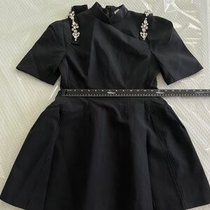 Elegant Black Dress with Embellished Shoulders